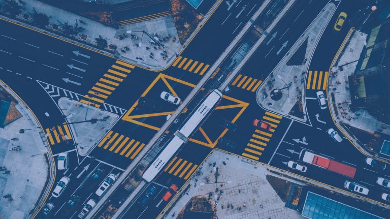 An aerial view of a congested traffic intersection.