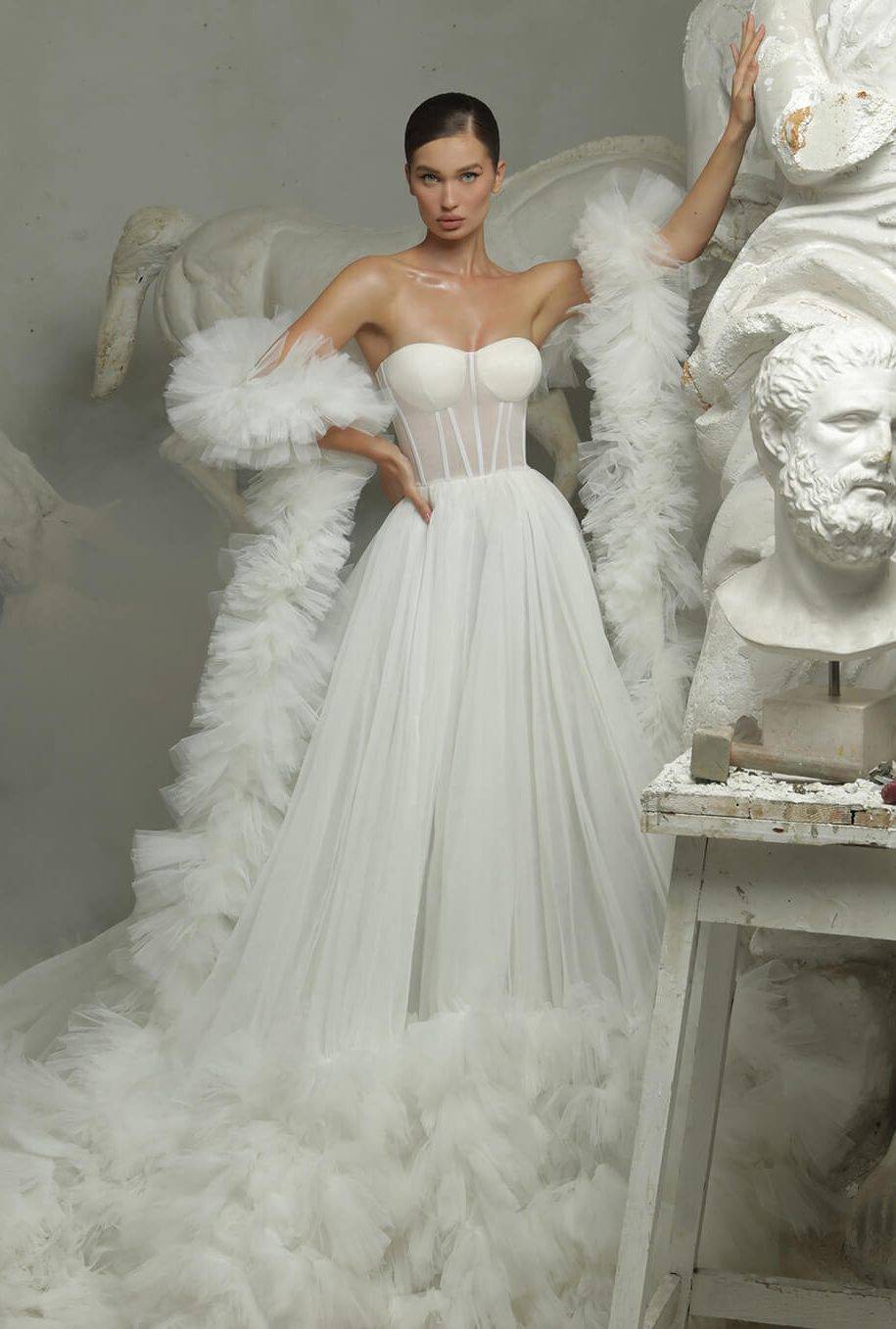 white gown with puffs and ruffles
