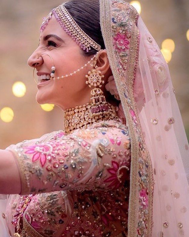 Bride in hot sale peach lehenga