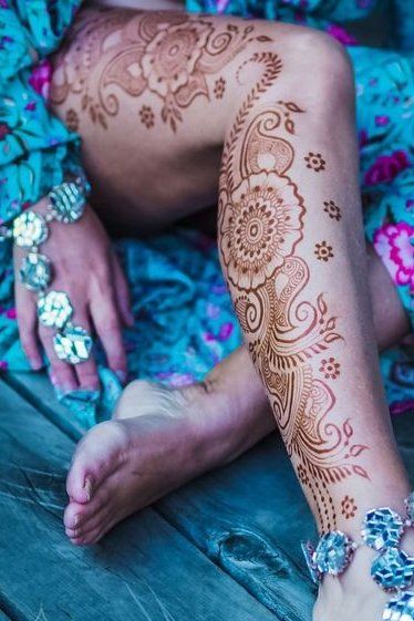 Female legs and hands with henna tattoo on green grass background Stock  Photo  Alamy