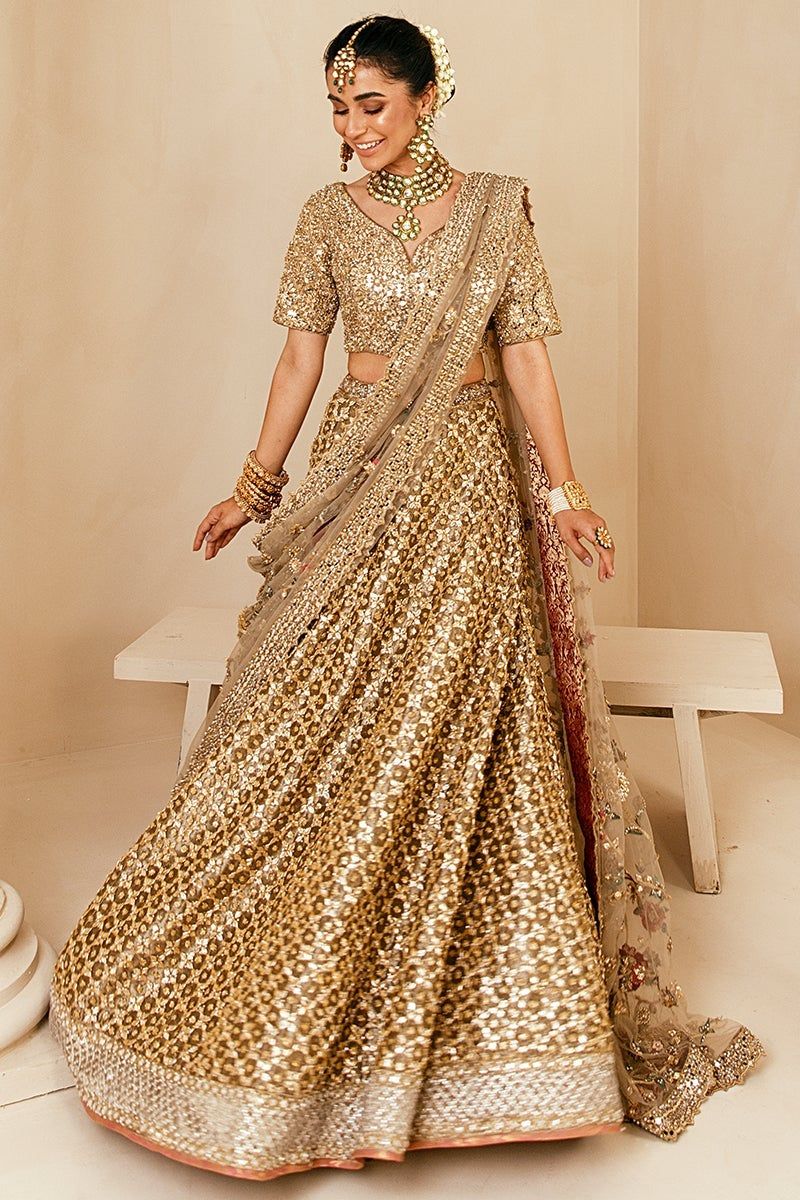 Golden bridal lehenga on sale designs