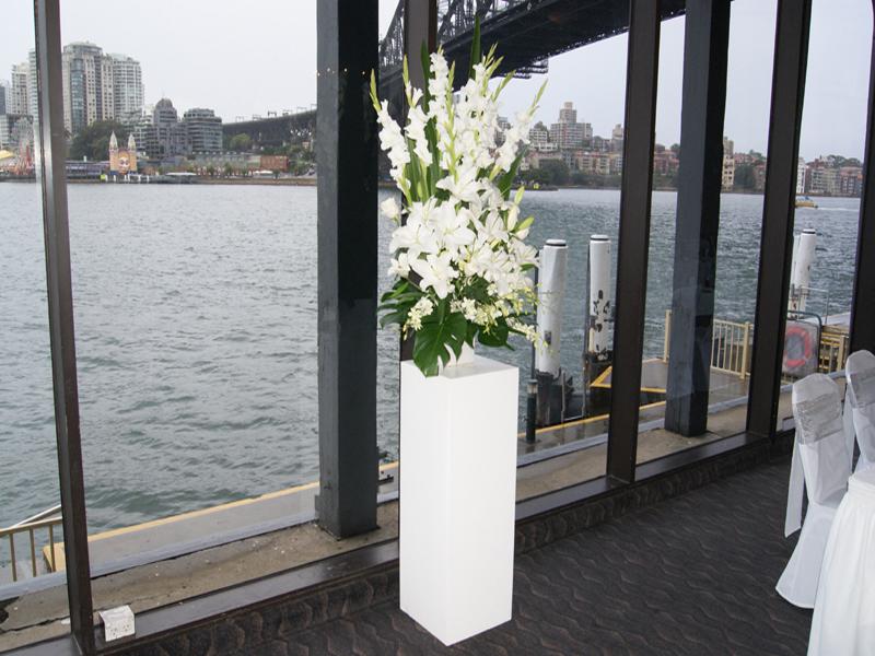 White Pedestal with Flower Arrangement