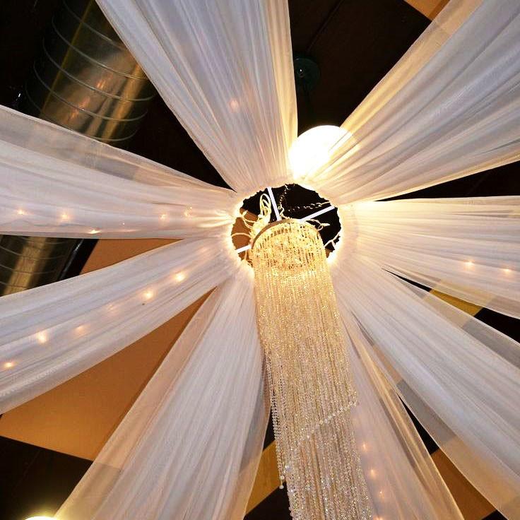 8 arm white ceiling drapes with chandelier