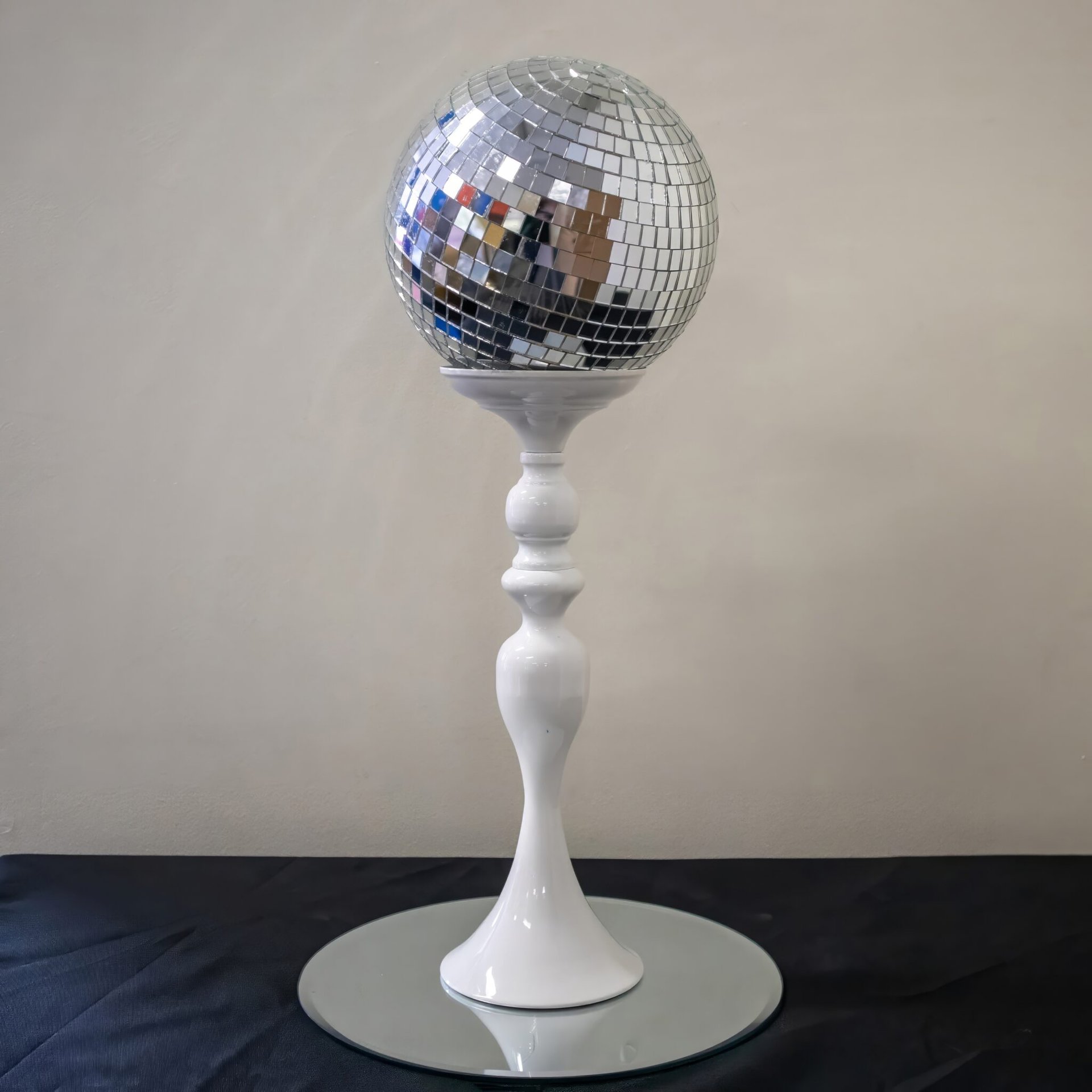 Silver Disco Ball on White Stand