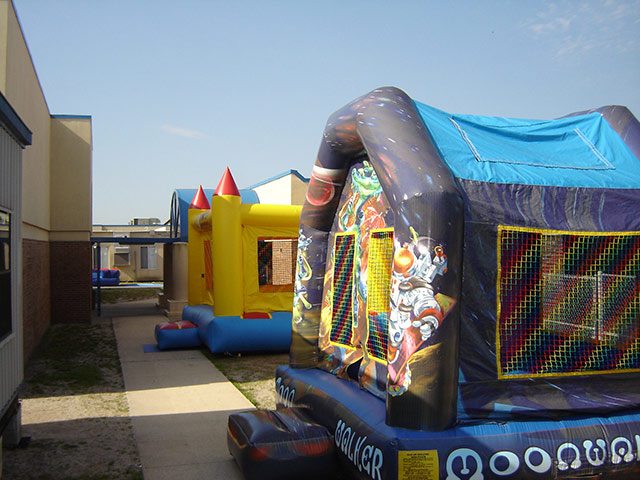 Castle & Moonwalk bounce house inflatable at large event