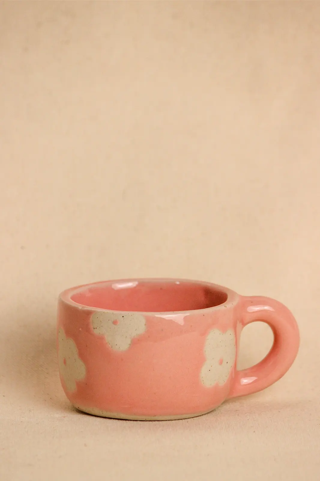 Pretty in pink ceramic daisy cup wiithout saucer, pink cup, ceramic cup, tea cup, ceramic tea cup, coffee cup, eco friendly coffee cup, hand painted cup, ceramic mugs, coffee mug, eco friendly mugs, hand painted mug, handmade mug, coffee mug ceramic, Toh, Sepia Stories, ceramic mug handmade, pink coffee cup, ceramic cups online